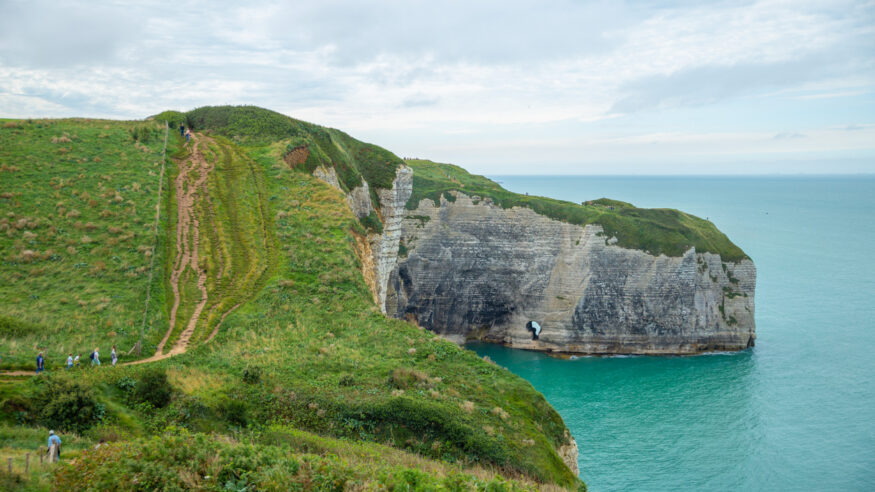Panoramic view of sea cliff trail in Étretat, France
