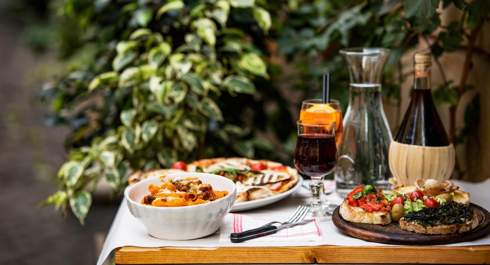 Italian food and wine on a table in Rome, Italy
