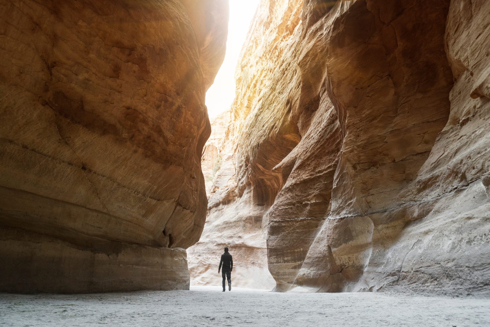 A person hiking through a canyon in Jordan