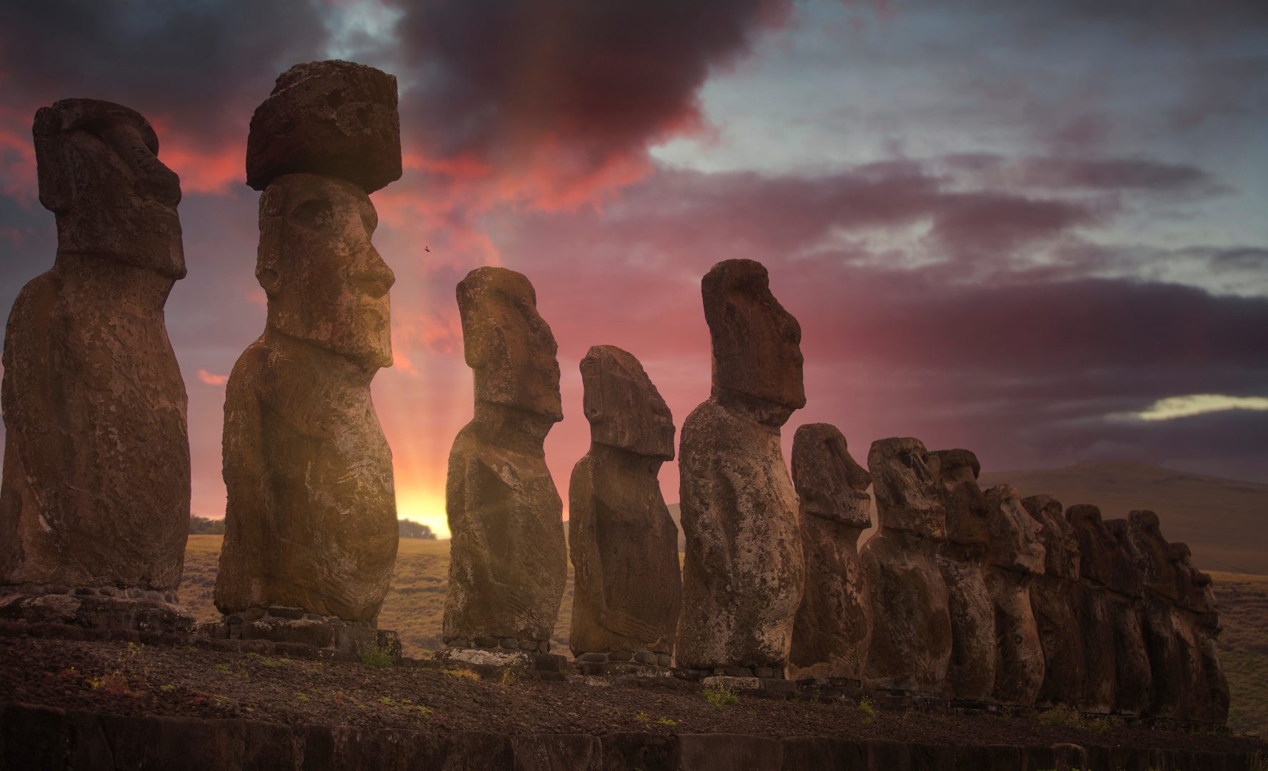 Statues at sunset on Easter Island, Chile