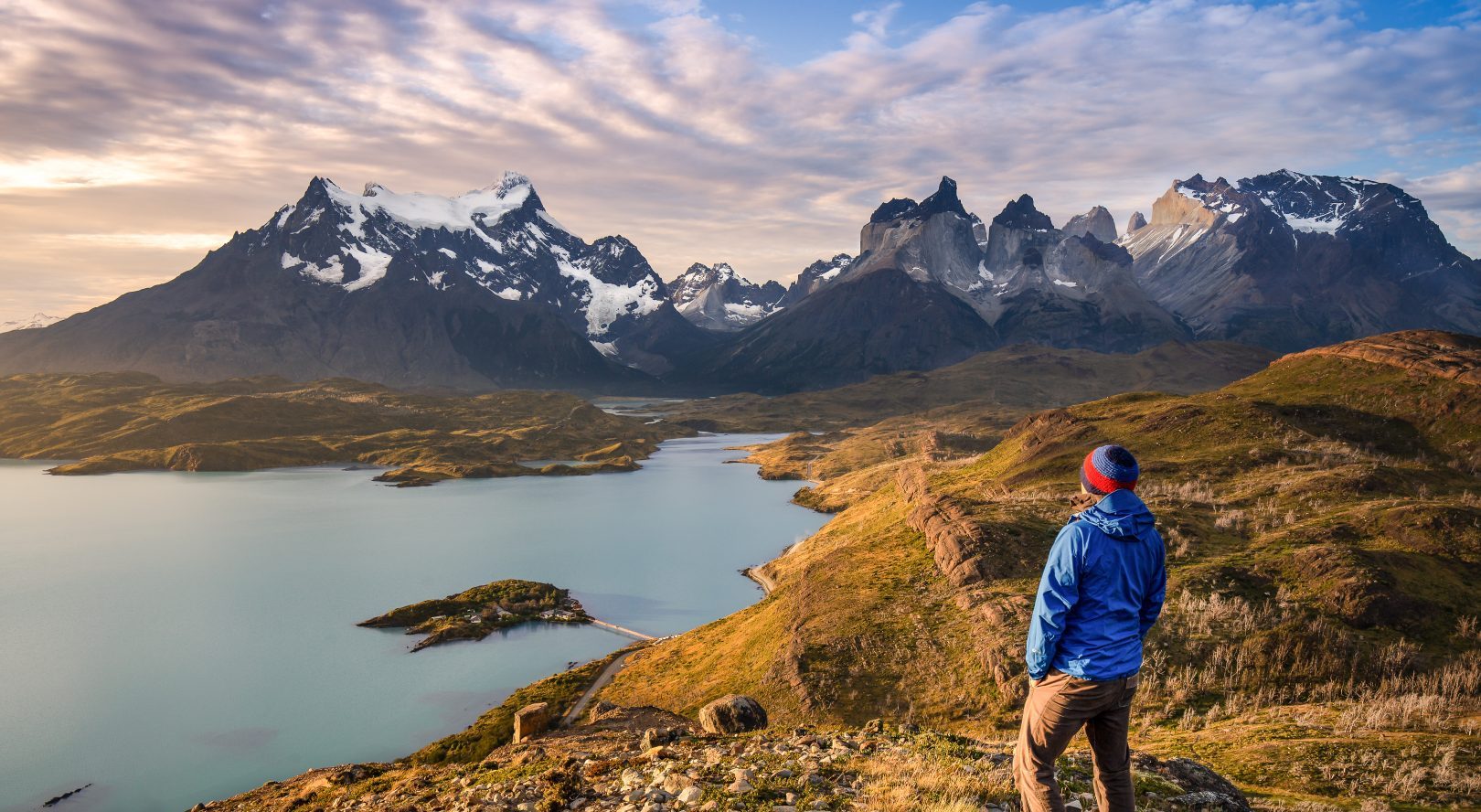 A hiker overlooking Torres del Paine in Patagonia, Chile