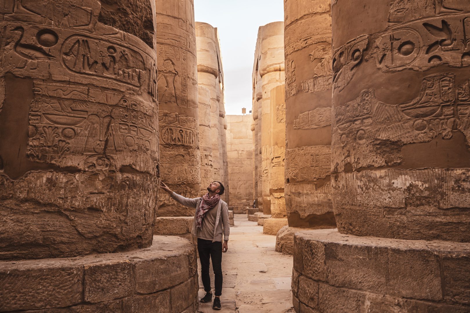 A traveler looking at ancient ruins in Egypt