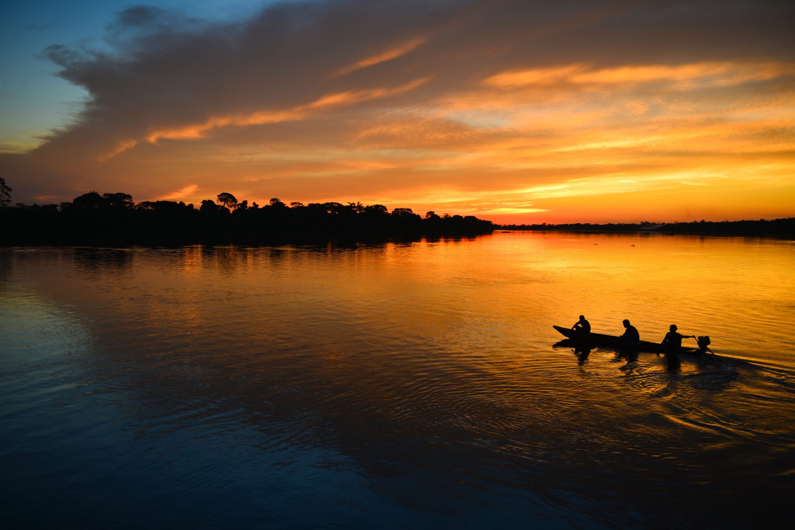 People in a canoe in the Amazon Rainforest