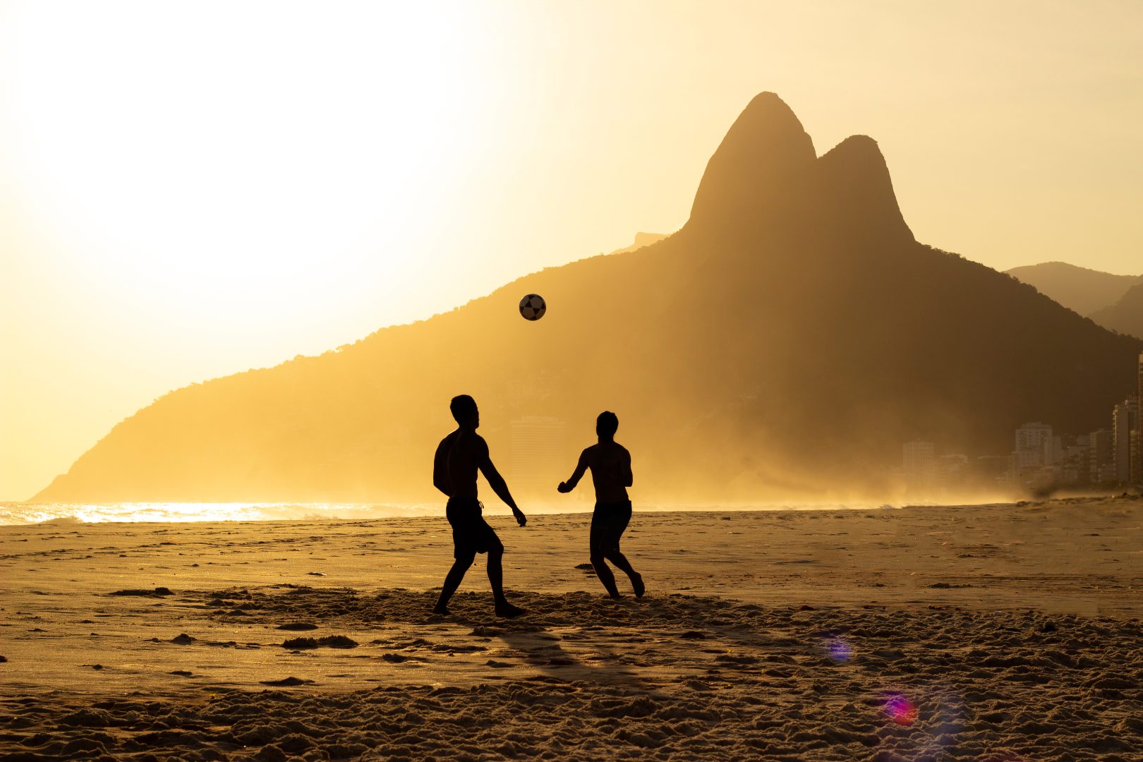 People playing soccer on the beach in Rio de Janeiro, Brazil