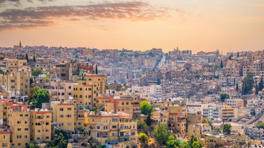 Beautiful view with many apartment buildings at sunset in Amman, Jordan.