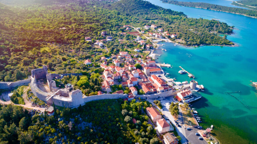 Mali Ston waterfront aerial sun haze view, Ston walls in Dalmatia region of Croatia